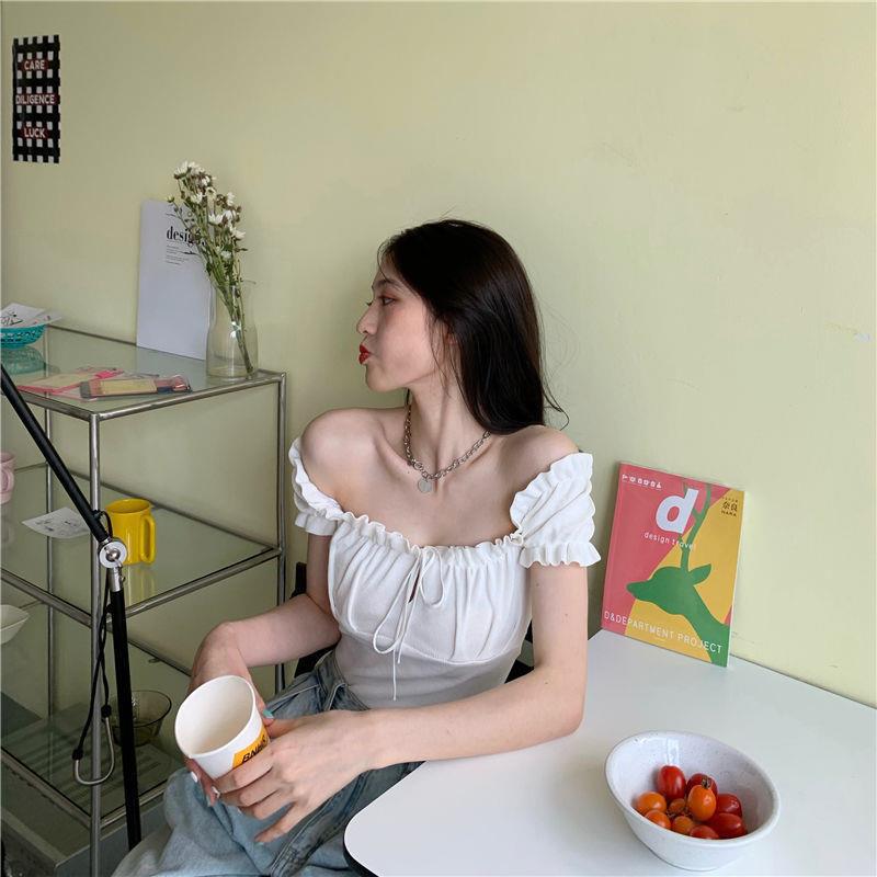 Sculpted Wood Ear Ribbon Drawstring Knit Top